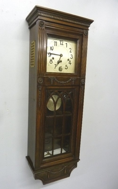 Circa 1910 Signed Colonial Clock Co.Wooden Wall Clock: Circa 1910 Signed Colonial Clock Co.Wooden Wall Clock with Signed Kienzle German Movement having 8 bar chimes - height 41" width 15" depth 8" - great condition.Key and pendulum are there.