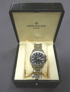 Patek Philippe Aquanaut Men's 38mm Wristwatch 5065/1A -: Patek Philippe Aquanaut Men's 38mm Wristwatch 5065/1A - has 2 Patek Philippe straps, stainless steel & tropical -Serial # M340109/4278610 Purchased in Mpls Mn in 2005.Exhibition back. Comes with paper