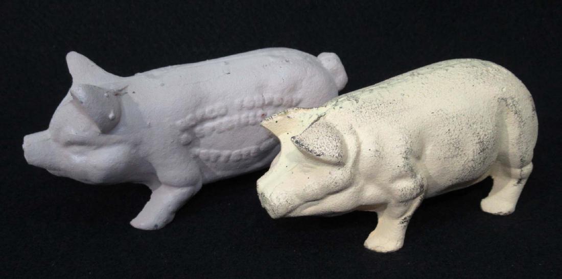 2 Modern C.I. Pig Door Stops (1 of 2)