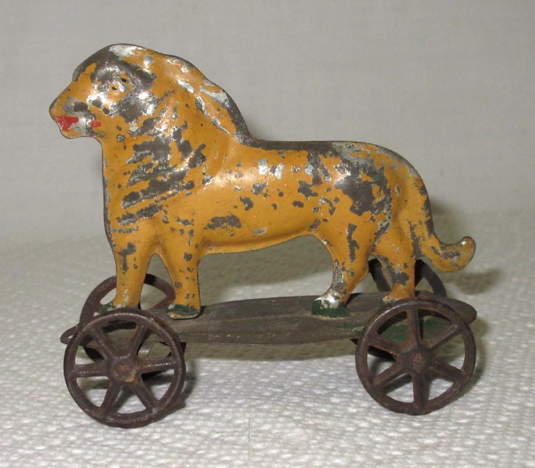 Early Tin Lion on Platform Toy (1 of 3)