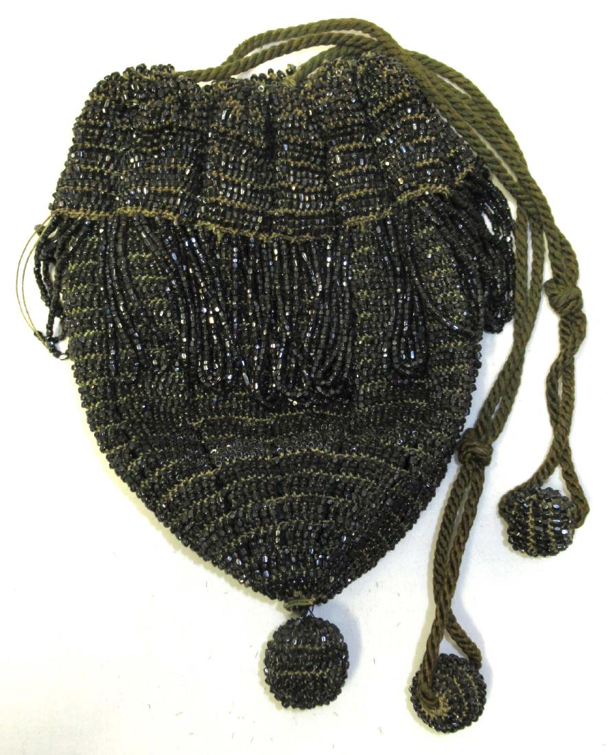 Antique Heavily Beaded w/Black Iridescent Beads: 6"L x $"W, 2" Loop Fringe, 3 Beaded Balls.