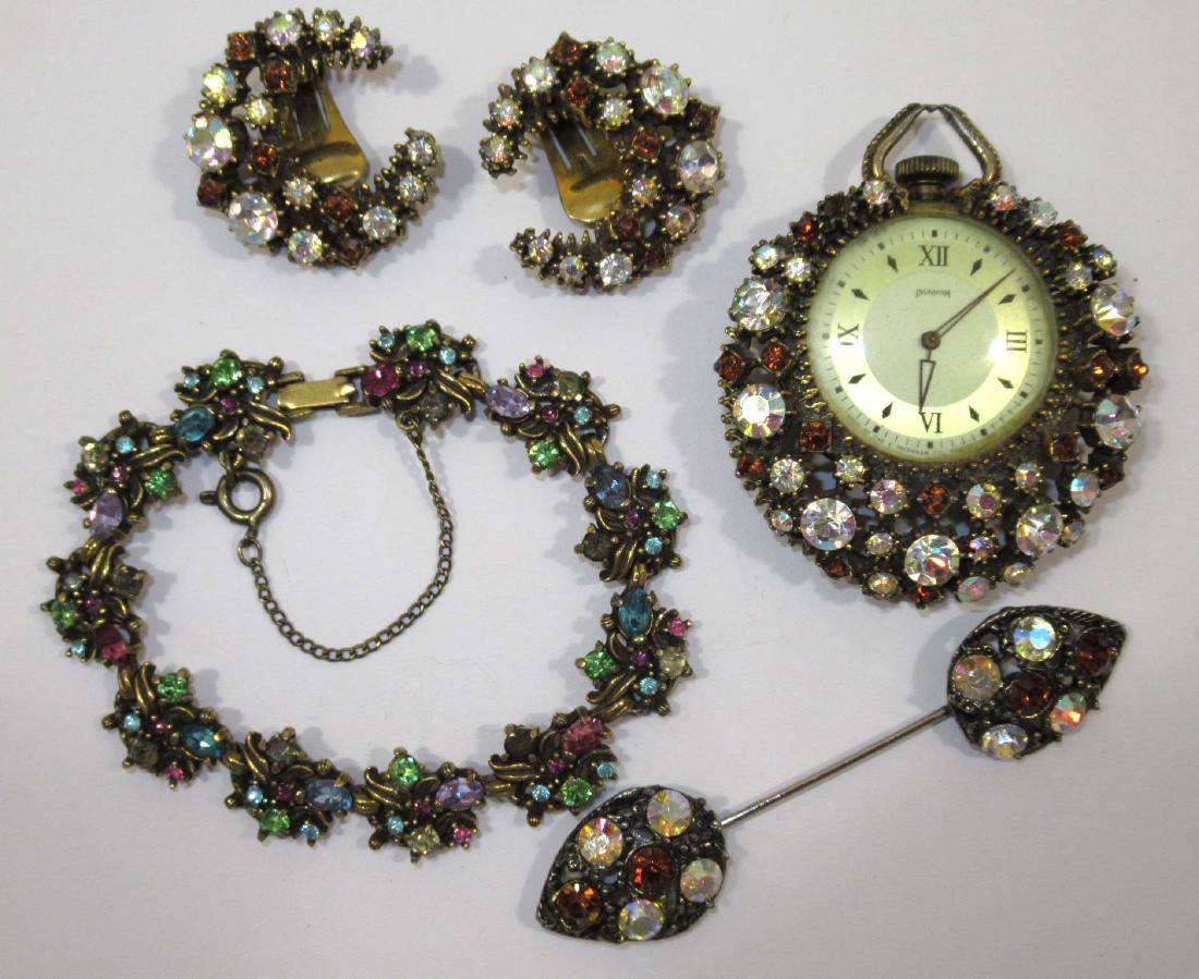 "Florenza" Topaz/AB Rhin. Pendant Watch, Earr's, Hat: Inc. Lovely, Ornate Topaz/AB Rhinestone 2 1/2" Pendant Watch, 3" Hat Pin, Earrings & Un-Marked Pastel Rhinestone Bracelet w/ Sfty Chain.