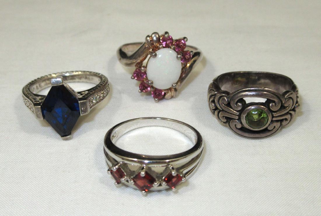 4 Sterling Rings: Inc. size 6 Spinel, size 8 garnet, size 5 1/2 citrine, size 10 tourmaline/opal