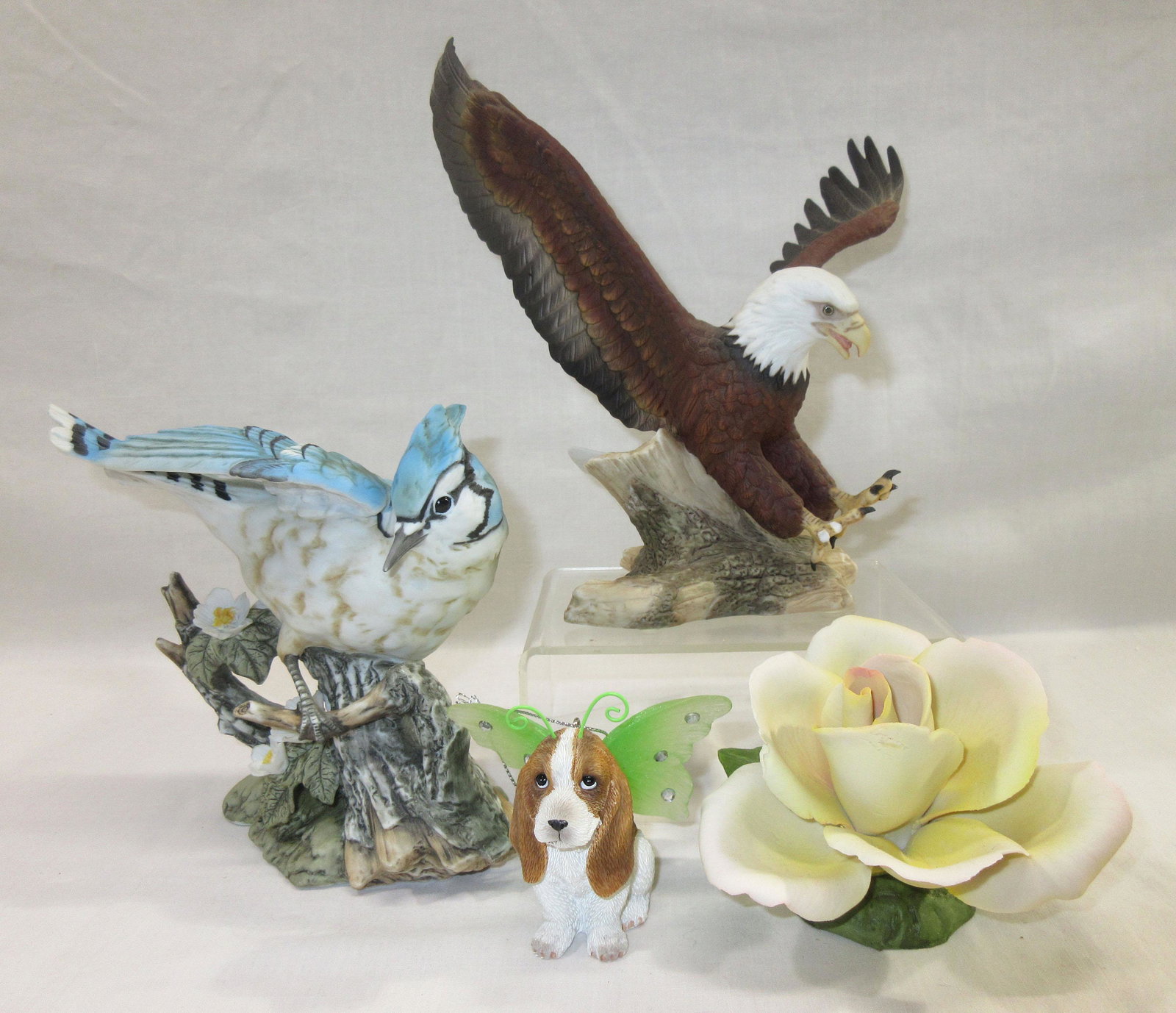 Group of Porcelain Birds, etc.: 6" blue jay, 8" eagle, 3" dog, 4" flower