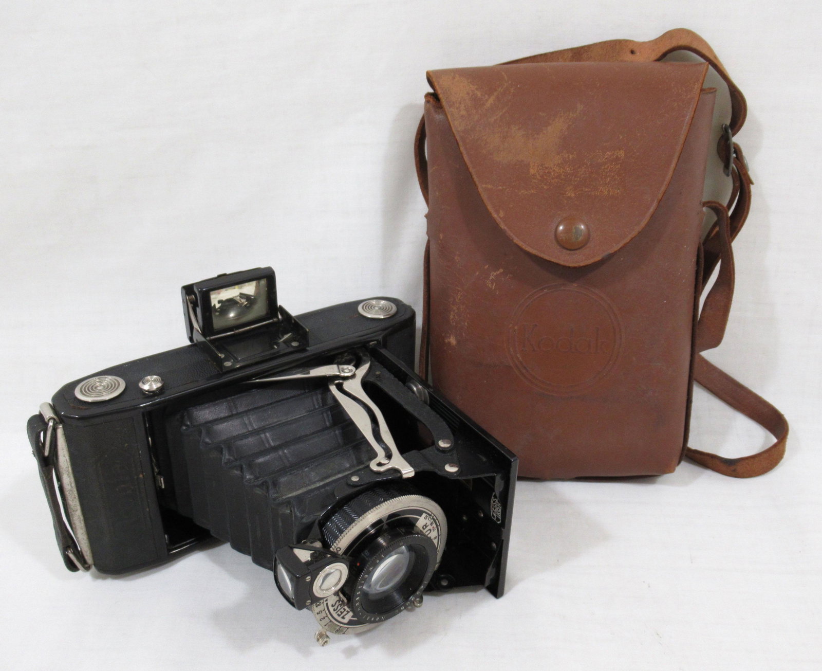 Zeiss Ikon Ikonta 120 Film Camera: Film frames are 6 x 9 cm or 2 1/4" x 3 1/4", pop up view finder, 1:1.4 Zeiss Ikon compur lens, housed in a brown leather Kodak snapsack with strap. 1940