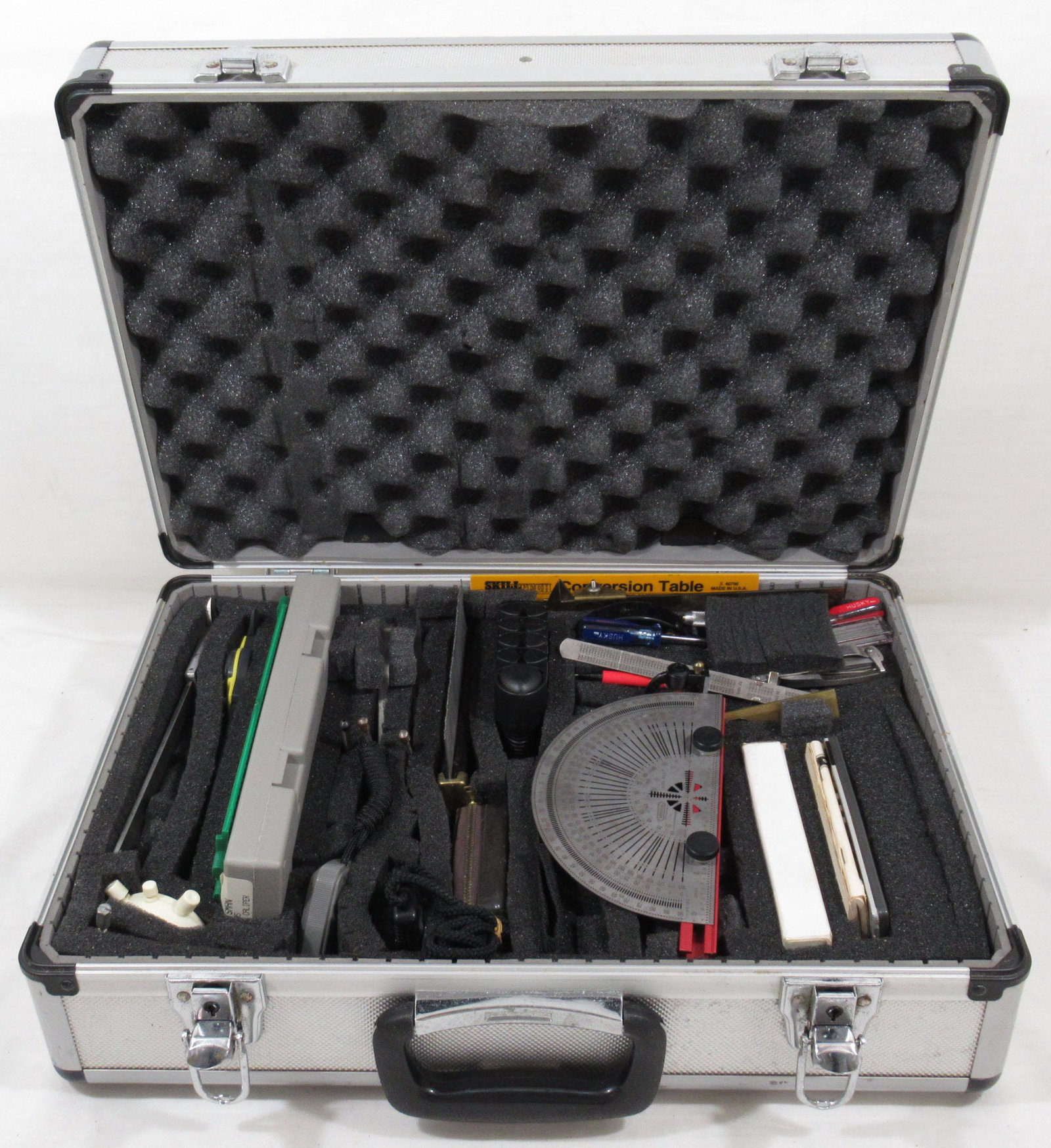 Engineer's or Scientist's Precision Measuring: Includes many specialized calipers and other measuring and drafting tools such as a metal protractor, a craftsman commercial micrometer, several stopwatches, a Radio Shack programmable scientific calc