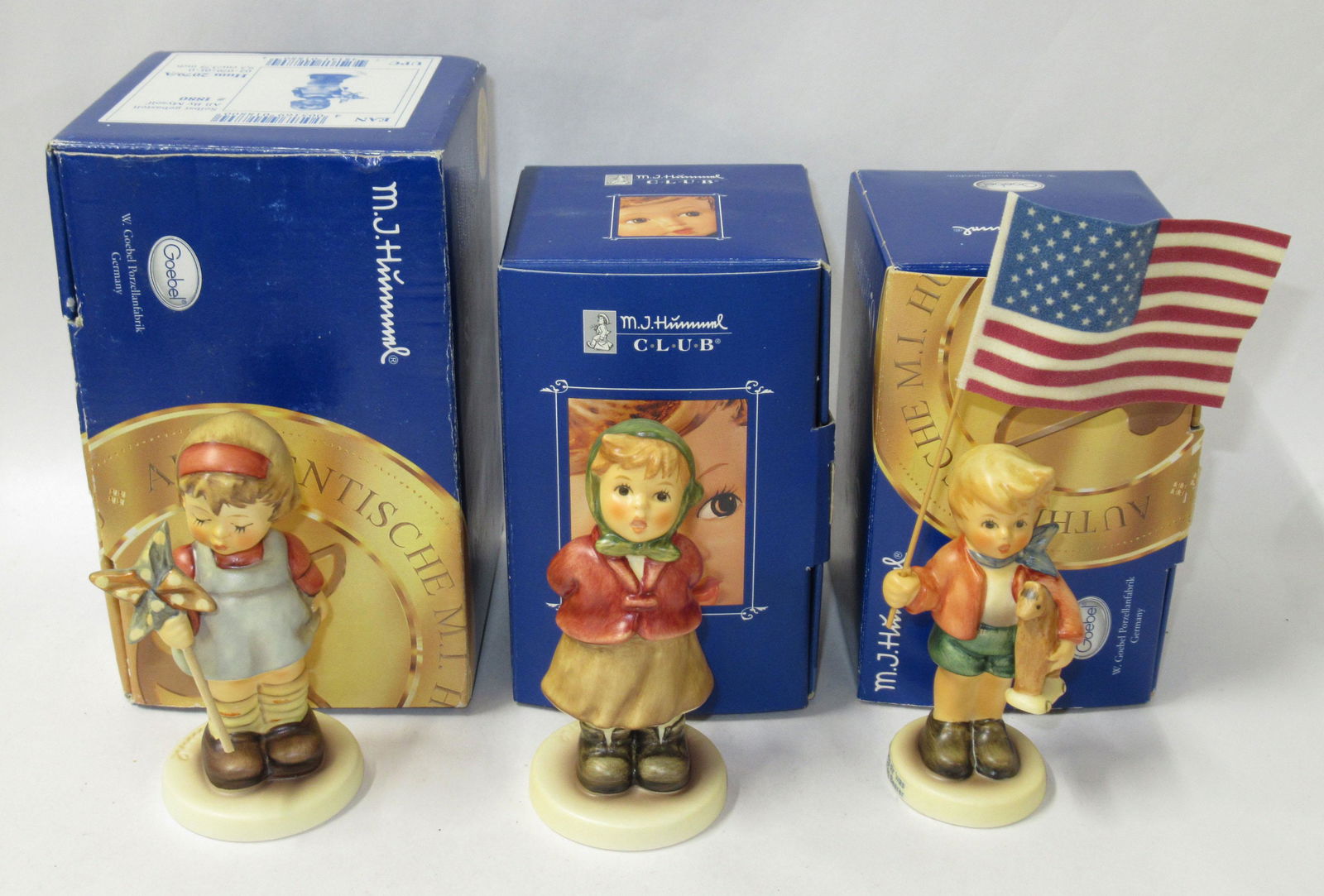 3 Hummels in Orig. Boxes: "All by Myself" 3 3/4"T, "Little Flag Bearer" 5 7/8"T to top of flag, "Clear as a Bell" 3 3/4"T