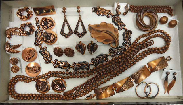 Lot of Copper Costume Jewelry: 21 pc. Of copper jewelry to include a heavy beaded necklace, choker, bracelets, pins and clip back earrings