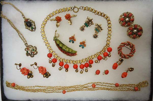 Faux Coral Jewelry Lot: Lot includes book chain drop bead necklace, 2 pendant multi-stone necklaces, brooches, and 7 pr. Clip & screw back earrings, 1 sgnd. Coro