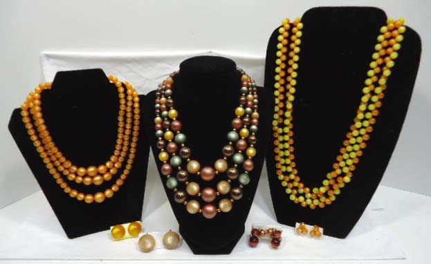 3 Autumn Moonglow Beaded Necklaces: 3 Necklaces to include a 27" orange & yellow with ornate clasp, a 3 strand 17" grown, gray, green & gold with gold spacers, and a 3 strand orange 17" choker All with earrings.