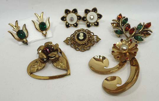 Elegant Coro Brooch & Earring Lot: 3 Lovely Brooches all Gold Tone; A Gold Filigree Cameo, 2 Gold Tone & Red Rhinestone Plus 3 pr of Earrings Consisting of a pr of Emerald Rhinestone Birds, a Multi Color Marquise Rhinestone Set & A Bla