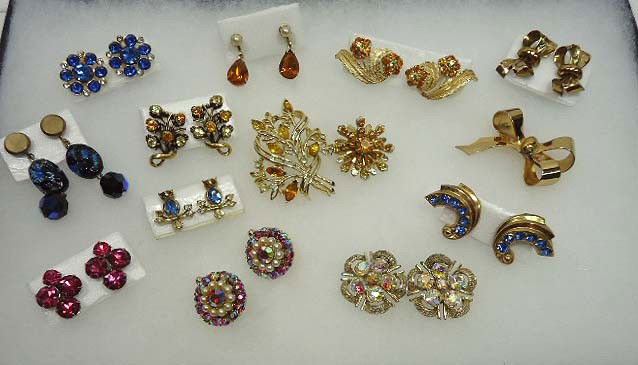 Coro Rhinestone Jewelry Lot: A little of this and a little of that! All signed Coro. 14 pc in all inc. 3 pc gold pin & earring set, 2 gold rhinestone pins, 10 pr earrings with gold, pink, blue, A.B. & faux pearls, one interesting