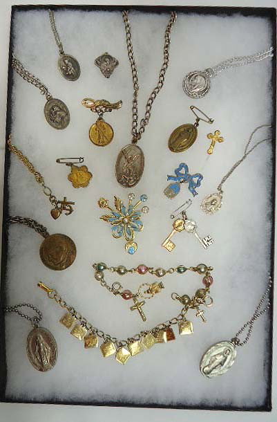 Religious Jewelry Lot: Inc. 9 medal necklaces, 2 bracelets, flower brooch with enameled Mary, 6 medals and a pin
