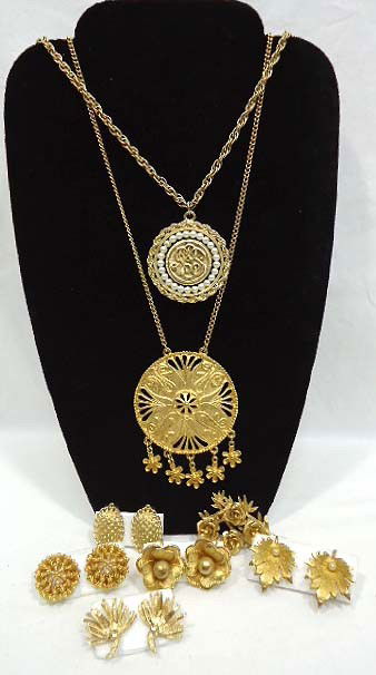 Coro Brushed Goldtone Lot: Includes two 14 1/2" pendant necklaces, a brooch and 5 pr. Of testured earrings