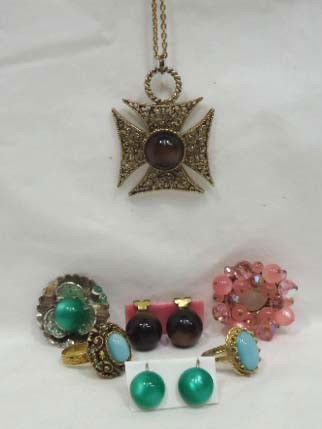 Moonglow Potluck Jewelry Lot: Includes crusador cross necklace with mink brown cabachon and matching earrings, silvertone brooch with green cabachon and matching earrings, 2 goldtone ornate rings with light blue cabachons and a pr
