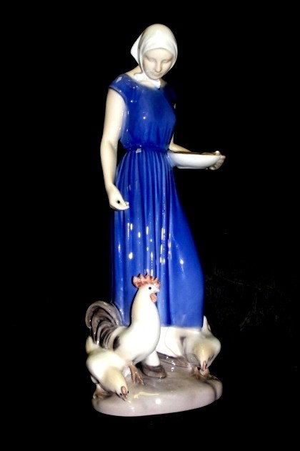 Bing & Grondahl Denmark Girl Feeding Chickens: The detail is wonderful. She is dressed in blue with a white scarf around her head. The chickens are so well done .9 1/2" tall, 3 1/2" across at the base. Condition excellent, with no chips, cracks, o