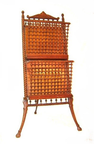 Rare Oak Stick & Ball Folio Or Magazine Rack: Great example of the Stick & Ball era type of items, that have become very collectible. Having two fold out racks, twisted frame work on modified hoof feet. Condition very good. H. 47 W. 26''