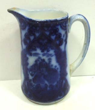 Early Flow Blue Pitcher: 7 1/8"