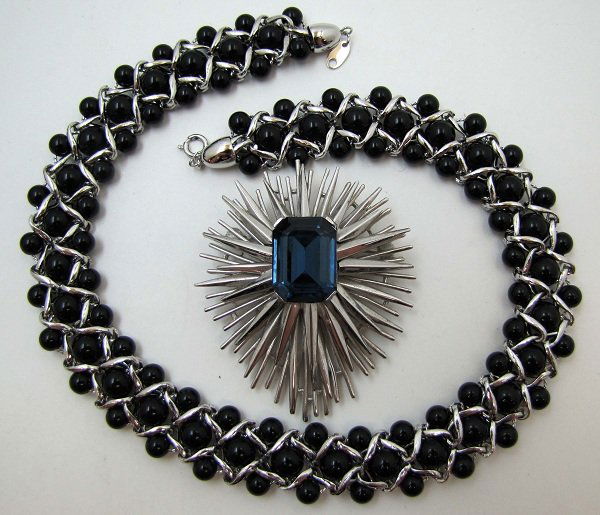 CROWN TRIFARI, TRIFARI TM Neck./ Brooch: 2 1/2" x 2 1/8" Atomic Star Burst Brooch w/ 20mm Sapphire, Tabletop Glass Center Stone & 17" Woven Silver Link Choker w/ 3 Rows of Black Lucite Bead's, Marked Trifari TM