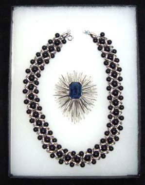 Crown Trifari, Trifari TM Necklace/Brooch: 2 1/2" x 2 1/8" Silver Starburst Brooch w/ 20mm Table Top Sapphire Glass Faceted Stone, 17" Woven Silver Link Choker w/ 3 Rows of Black Lucite Beads