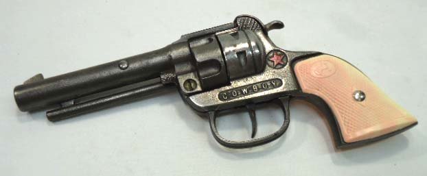Hubley Cap Gun: 8"L w/ Checkered Pearl Type Grips and Colt Horse Logo in Oval. Marked Made in USA