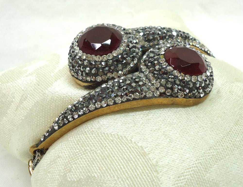 Sterling Bracelet w/ Rubys: Mkd 925 and set w/ two 5ct rubys & quartz 2 3/4"W