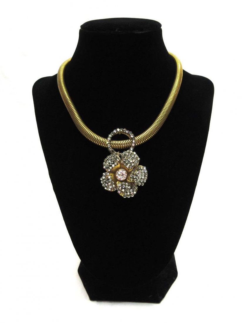 Miriam Haskell Rhinestone Choker: 14 1/2" Goldtone Snake Chain Collar w/ Suspended Prong Set Rhinestone Flower. 2 3/4" Ornamented Ext. Chain. Clasp & Pendant Signed.
