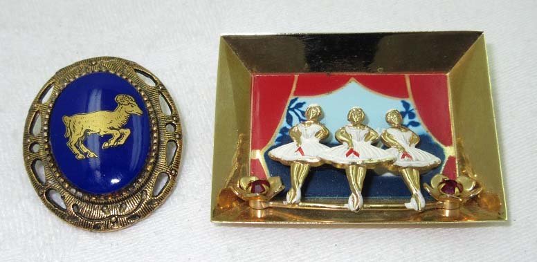 2 Quality Enameled Pins: 2" x1 1/2" Gold Shadow Box Pin w/ Enameled Ballerina's & Rhin. Flowers & 1 1/2" x 1 1/8" Cobalt Blue Glass Pin w/ Enameled Gold Ram.