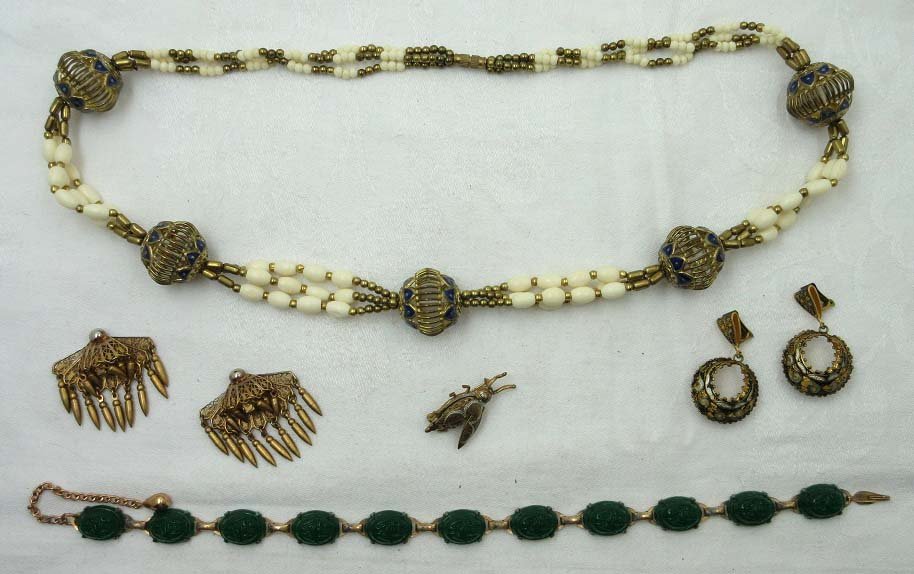 Egyptian Revival Jewelry Collection-Scarab, Damascene: Inc. 28" Enameled & Faux Bone Bead Necklace w/ 1" Openwork Goldtone & Cobalt Enameled Bead's. 15" Emerald Glass Scarab Choker. Unusual 1 1/2" Brass Clip Earrings w/ Bullet Dangles. 1 1/2" Damascene Cr