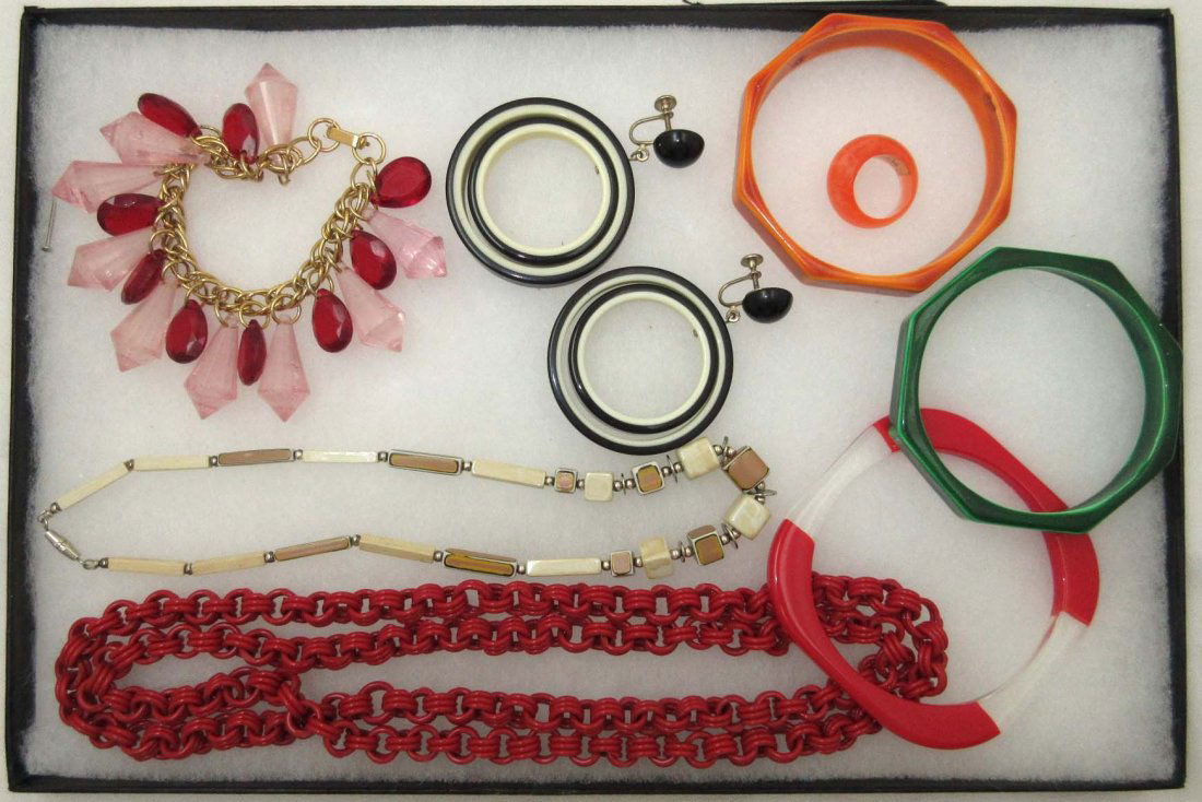 1960-80's Lucite Mod Art Jewelry, 8 Pc.: Inc. 2 7/8" Black & White Earrings, 2 7/8" Orange & Green Geometric Bangles, 3 1/4" Red & Clear Bangle, 7" Pink/Red Bracelet w/ 3/4 & 1 1/8" Drops, 38" Red Necklace, Sz. 5 1/2 Ring & 15 1/2" Tan Ename
