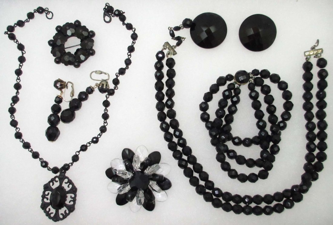 6 Pc. Black Glass Jewelry + 2 Lucite: Inc. 13" Dbl. Strand Choker w/ 2" Ext. 7 1/2" Triple Strand Bracelet. 1 3/16" & 2" Earrings. All Black Glass. 1 1/2" Black Glass & Lucite Pin. 2 1/8" Dimensional Lucite Pin & 15" Lucite Bead Choker w/