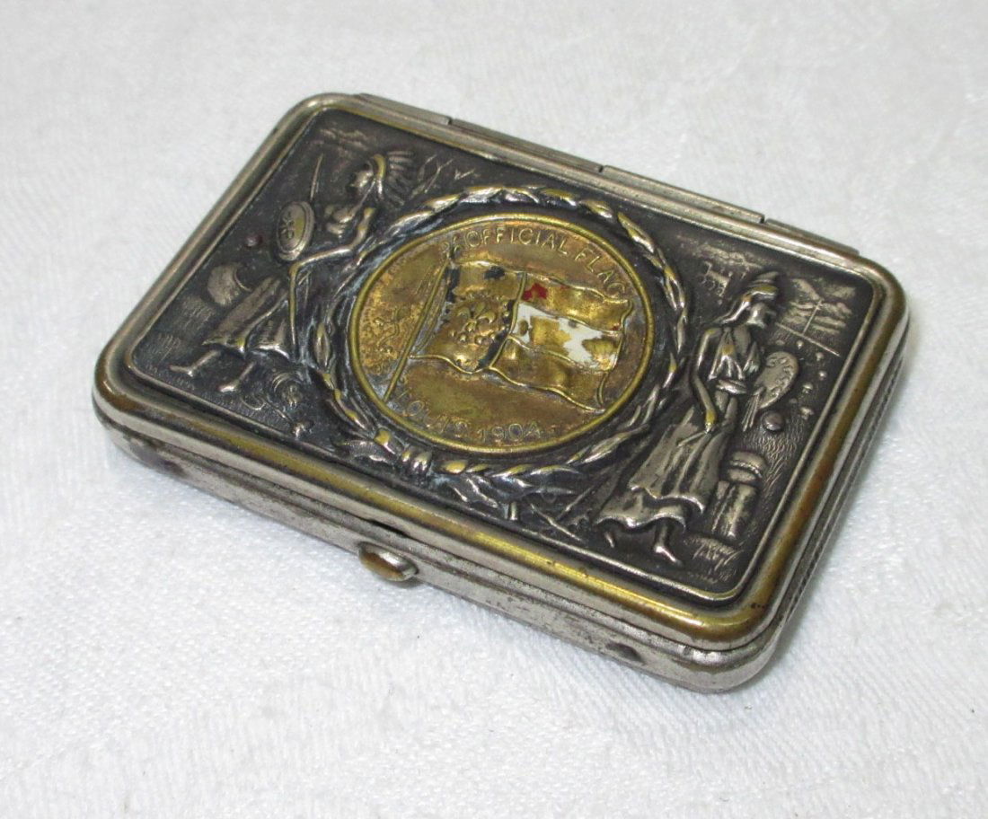 1904 Worlds Fair Match Safe: 2 3/8" x 1 5/8" 1904 Worlds Fair Match Safe with Enameled Official Flag of Louisiana Center Coin.