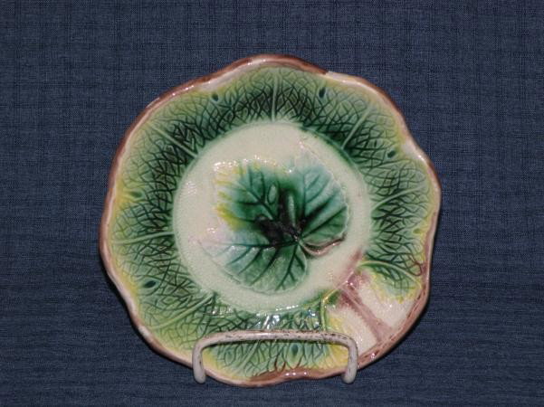 Majolica plate: ca. 1875-1900, leaf design in green, brown & yellow, 7"d;