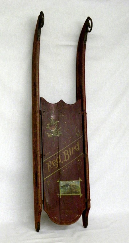 Red painted sled: ca. 1870-80's; "Red Bird" wooden sled with paint decoration and iron runners, 47";