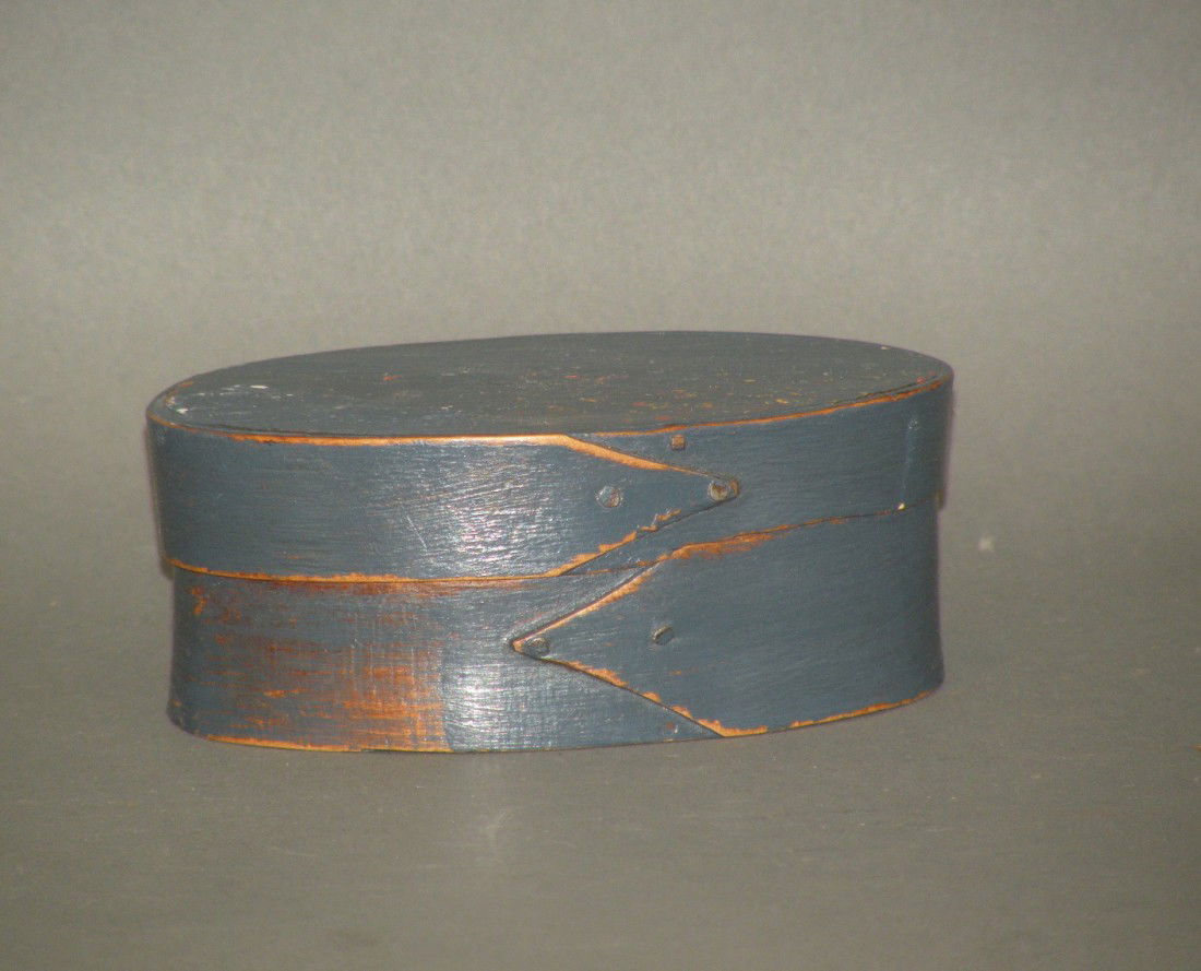 Blue painted shaker band box: ca. 1850-1900; oval wooden box signed "Elder Ch. Hinson" on lid, 4 3/8"x 2 ¾"x 1 ¾";