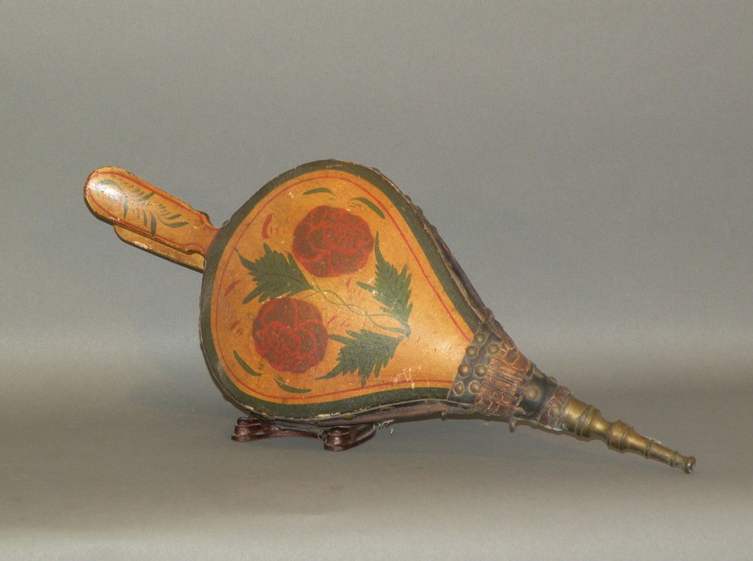 Paint decorated bellows: ca. 1820-50; with brass nozzle, original leather & red flowers on yellow ground paint decoration, 17"x 7"x 2 ¾";