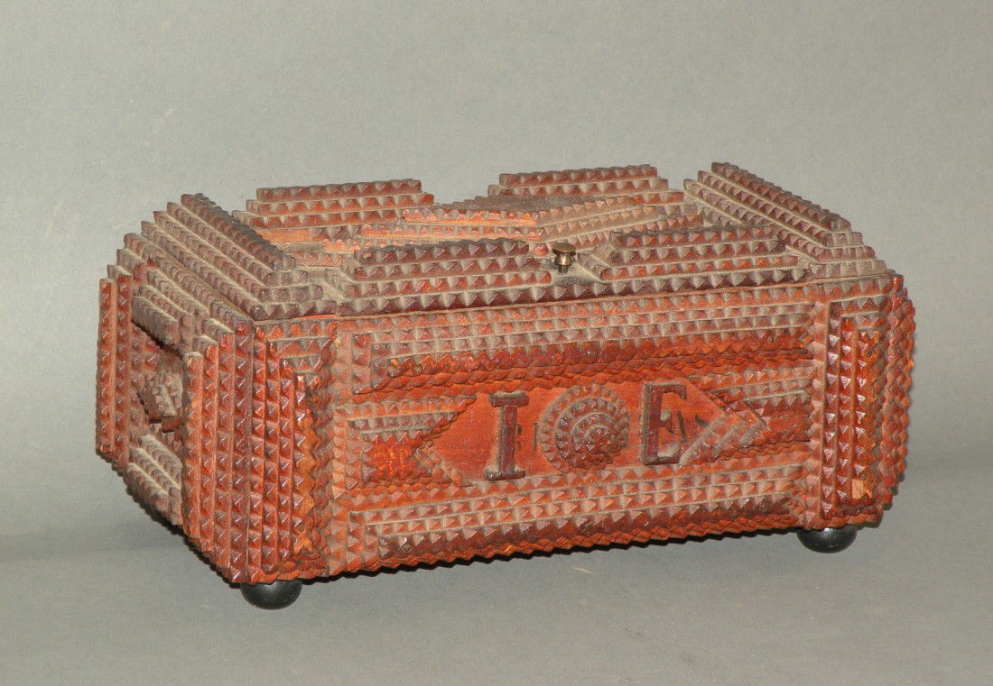 Tramp art box: ca. 1875-1910; wallpaper lined with initials "IE" on front panel & 4 ball feet, 10"x 5 ¾"x 4 ½";