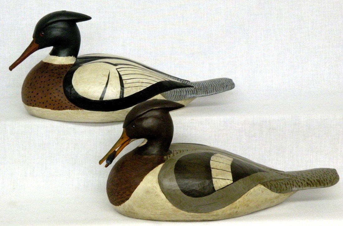 Pair of Hollinger red breasted mergansers: ca. 1998; signed "TH Theodore H. Hollinger" (Manheim, PA) with glass eyes, hen carved with mussel in it's mouth, 16";