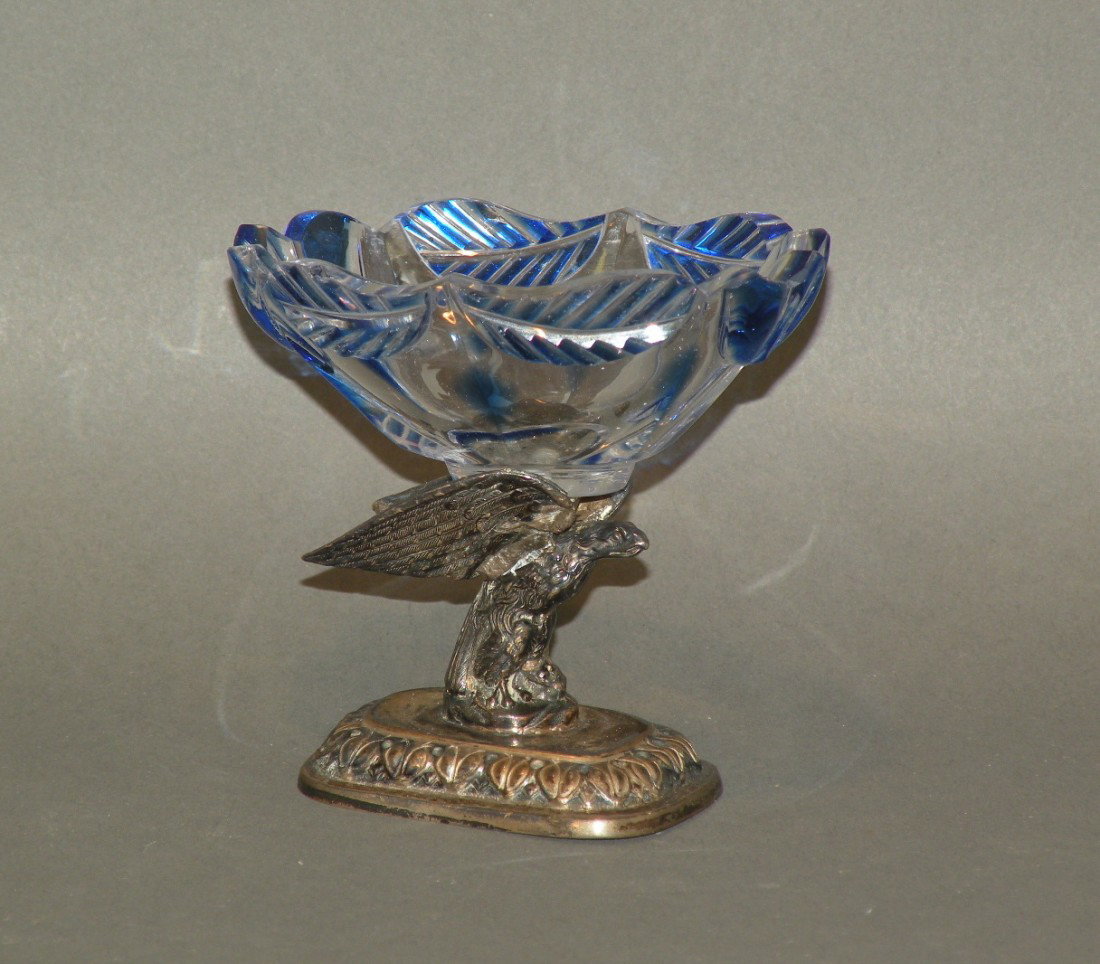 Cut glass master salt: ca. 1890; overlay cut glass cobalt over colorless master salt with leaf and flower design on silver spread eagle pedestal with unidentified marks, 3 1/8"x 2 ½"x 3 3/8";