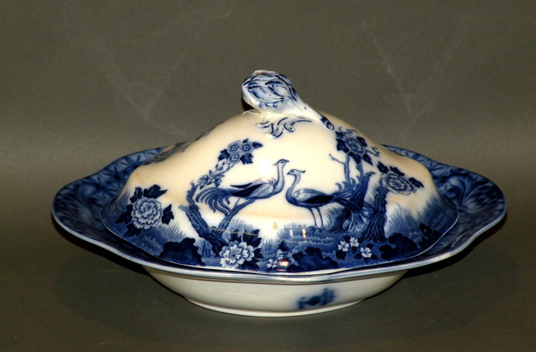 Flow blue transfer covered bowl: ca. 1905; earthenware marked "Mongolia Johnson Bros., England", 5 ½"x 9 3/8"x 10 5/8";