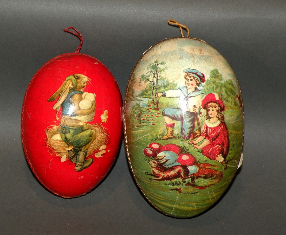 2 German papier mache eggs: ca. 1900-10; boys and girls playing with rabbits and chicks, 4 ½"; rabbit in lederhosen with mother rabbit, eggs and chicks hatching;