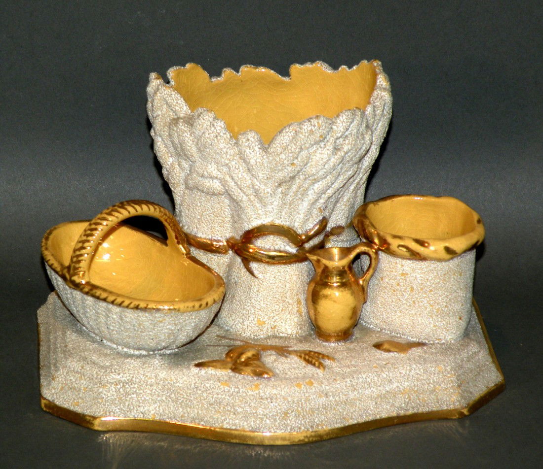 Yelloware cigar stand: ca. 1890; with three open receptacle forms basket, grain sheaves and bag, gilded details and sanded surface finish, 4 ½"x 5 ½"x 7 1/8";