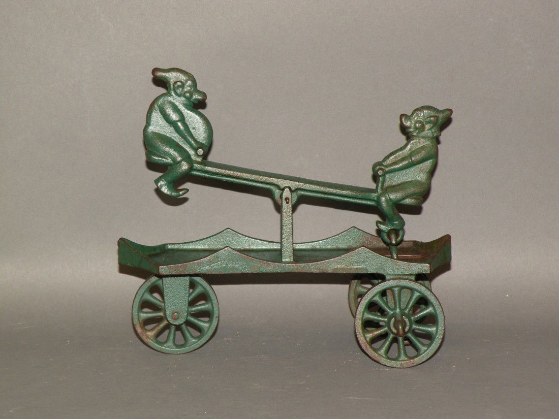 Dent Hardware Co. see-saw pull toy: ca. 1930; cast iron, 8";