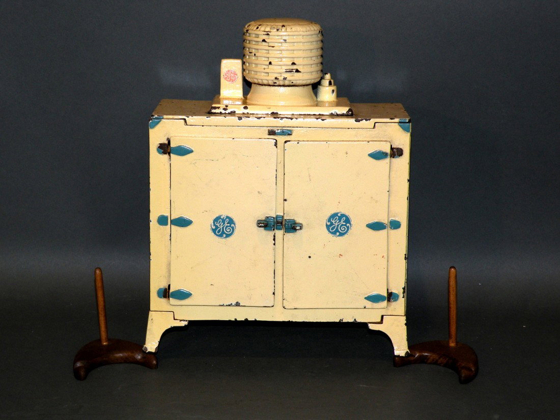 Hubley G.E. refrigerator: ca. 1910-25; cast iron and tin with ice tray, 9 ¾"h;