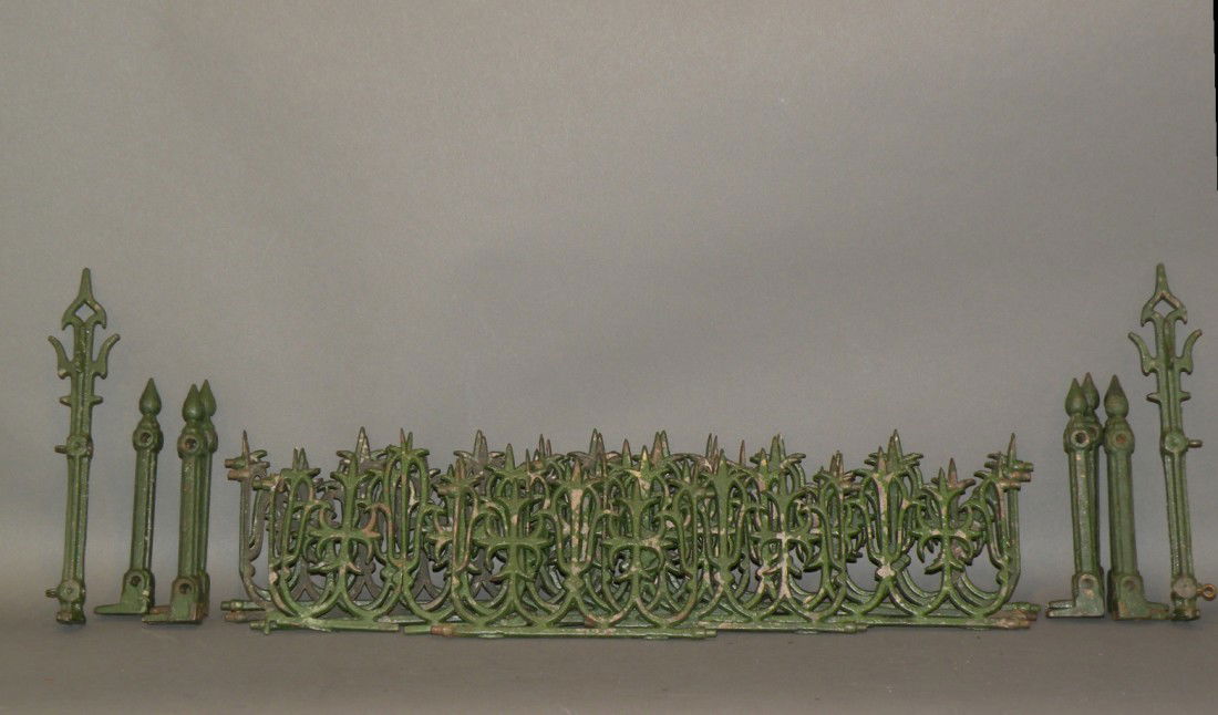 Set of green Christmas yard fences: ca. 1900; cast iron Christmas yard fence, six 1' sections with two 6 ½" sections, two 3" gates, two gate posts and seven line posts;