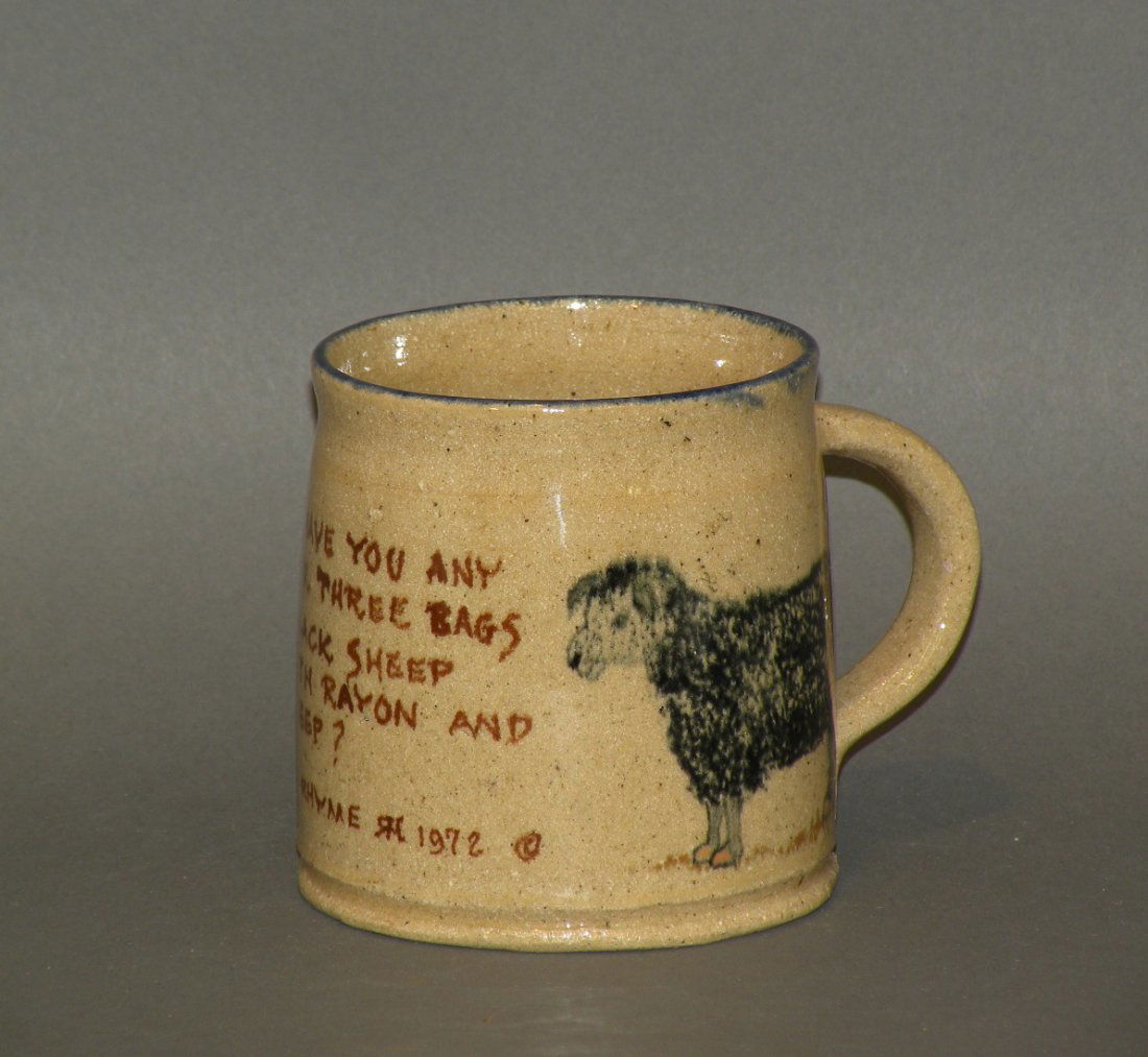 Left Handed Russell Henry mug: ca. 1972; earthenware with stenciled sheep in blackish blue and peach on tan ground with Hay Creek Mother Goose rhyme in brown and blue rim, signed and dated 5/72, 3 ¼”d, 3 3/8”h;