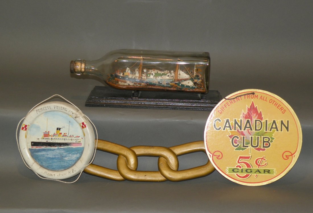 Tray lot of collectibles: ca. 1950s; Odd Fellows Lodge carved chain, 10 ½”; Saint John N.B. scene plaque; ship in bottle, 11”; paper Canadian Club cigar sign;