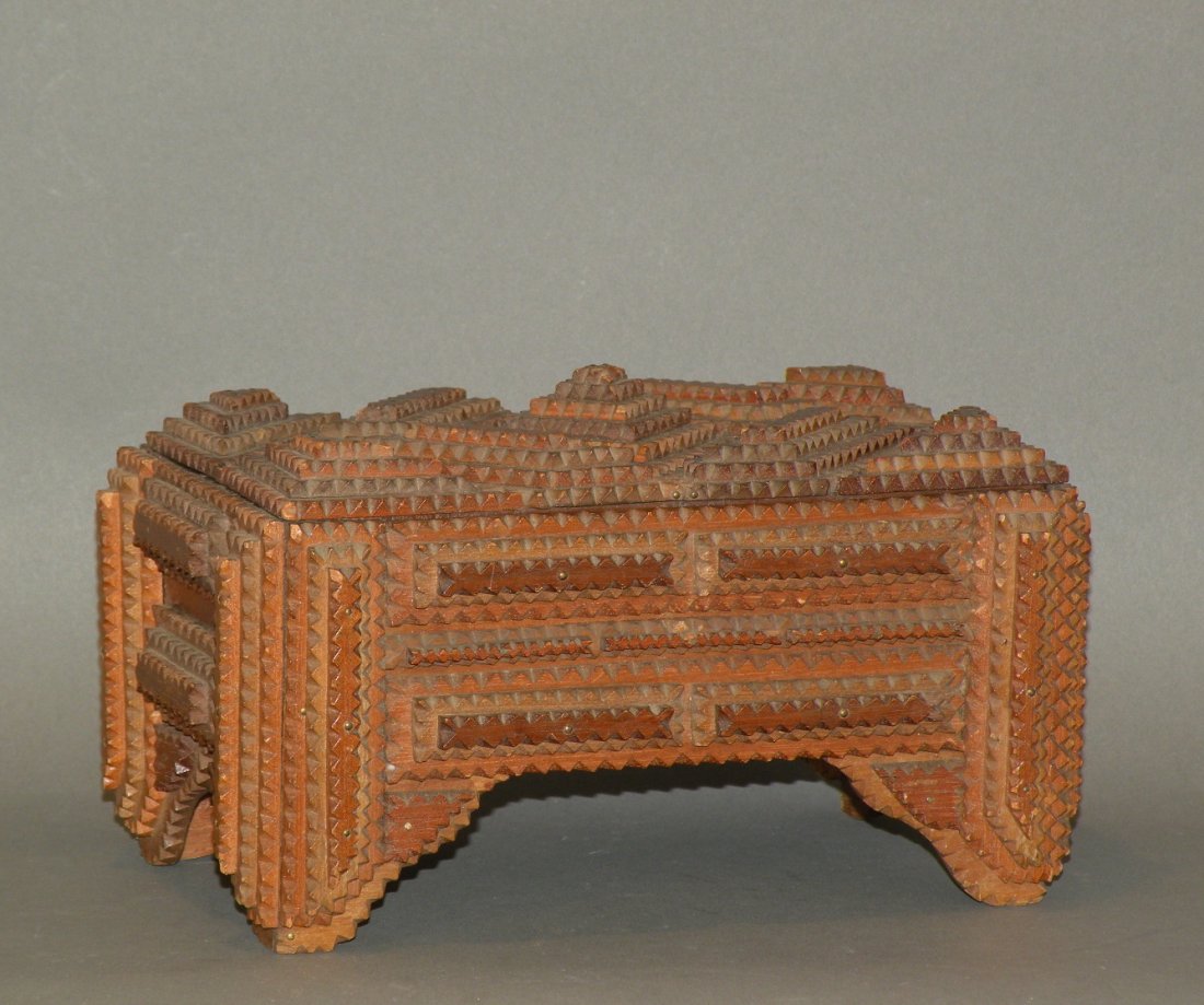 Tramp art box: ca. 1870-1900; with hinged lid and corners extend to form legs, 9”x 5 ¾”x 5”;