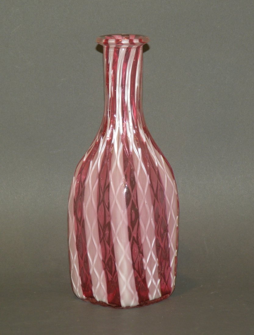 Cranberry & milk glass barbers bottle: ca. 1900; molded diamond pattern with squared base, 8”h;