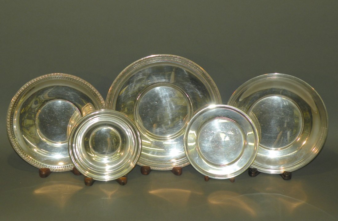 5 pieces of sterling silver: ca. 1940-60; bowl with reeded rim marked “Gorham”, 5 ¾”d, 1 ¼”h; plate with reeded rim marked “Frank M Whiting”, 6”d; plate with reticulated rim and acanthus motif by Watson Co., 8”d